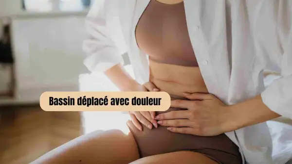 Femme enceinte tenant son ventre, souffrant de douleur au bassin. Comment soulager cette gêne ?
